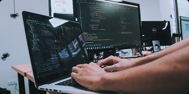 Developer working on custom software systems